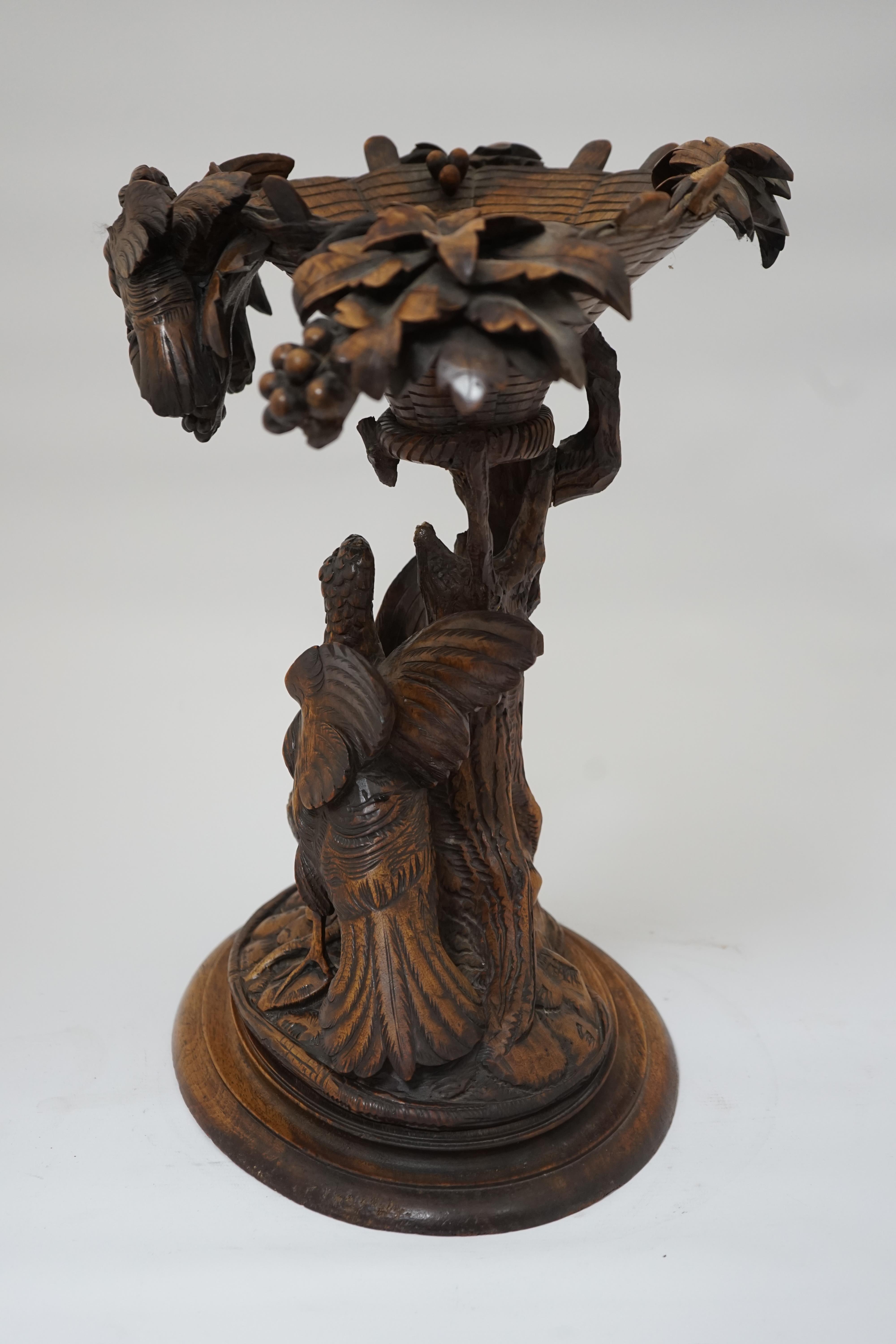 A 19th century Black Forest carved wood centrepiece